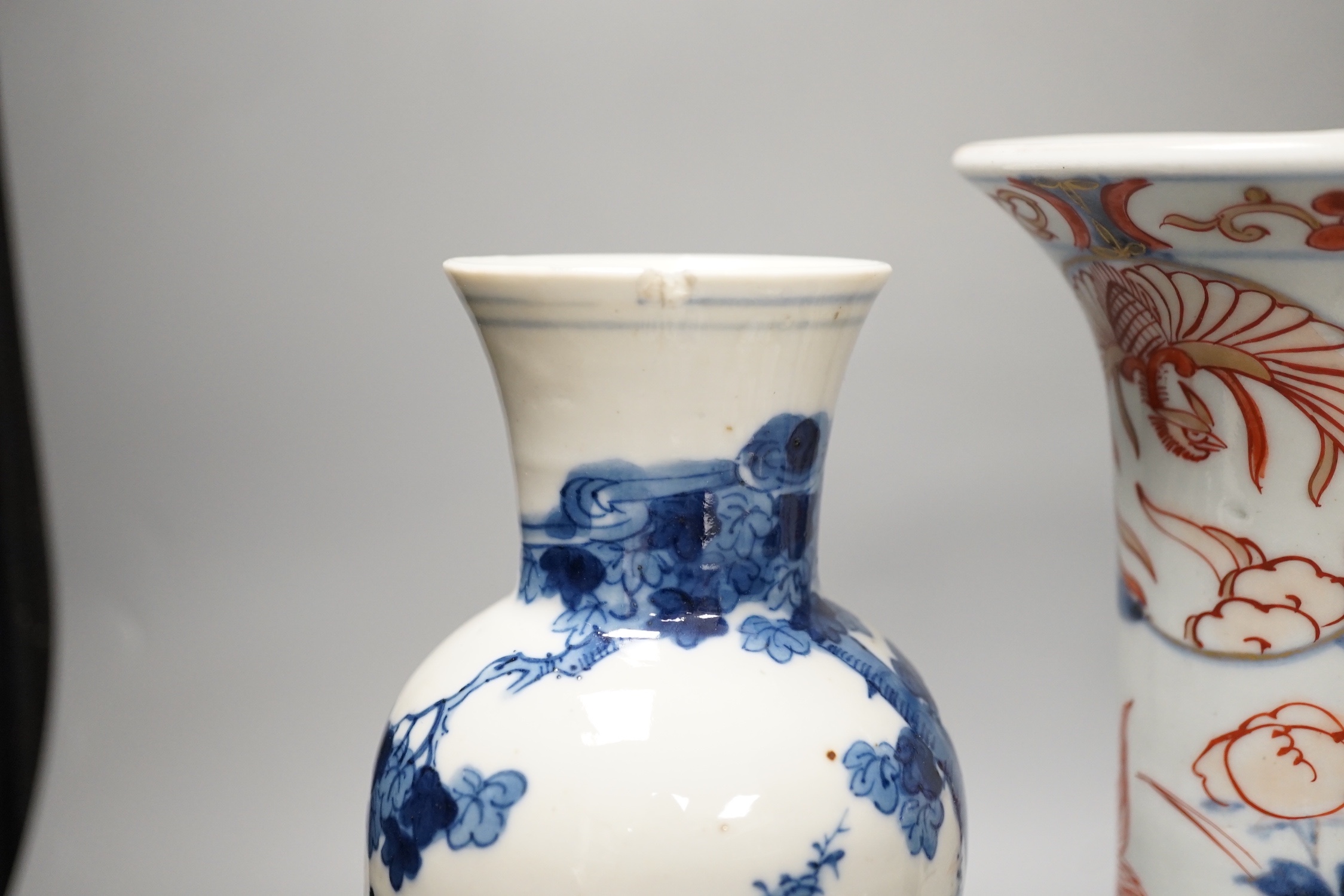 A Japanese Edo period Imari vase, 22. 5 cm, two 19th-century Chinese blue and white baluster vases, an Annamese blue and white box and cover, a Chinese famille rose plates and a blue and white dish
